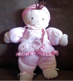Carter's Brown Hair Doll wearing a Pink Flower Dress and a Hat