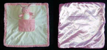 Kids Preferred Pink Blankie with a Pocket holding a Small Pink Bunny