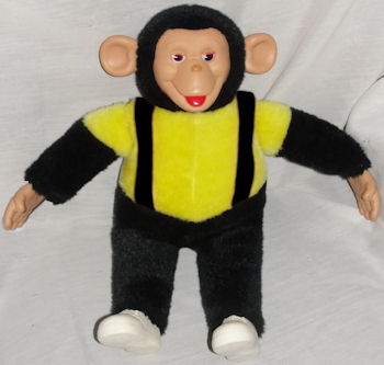 old monkey with banana toy